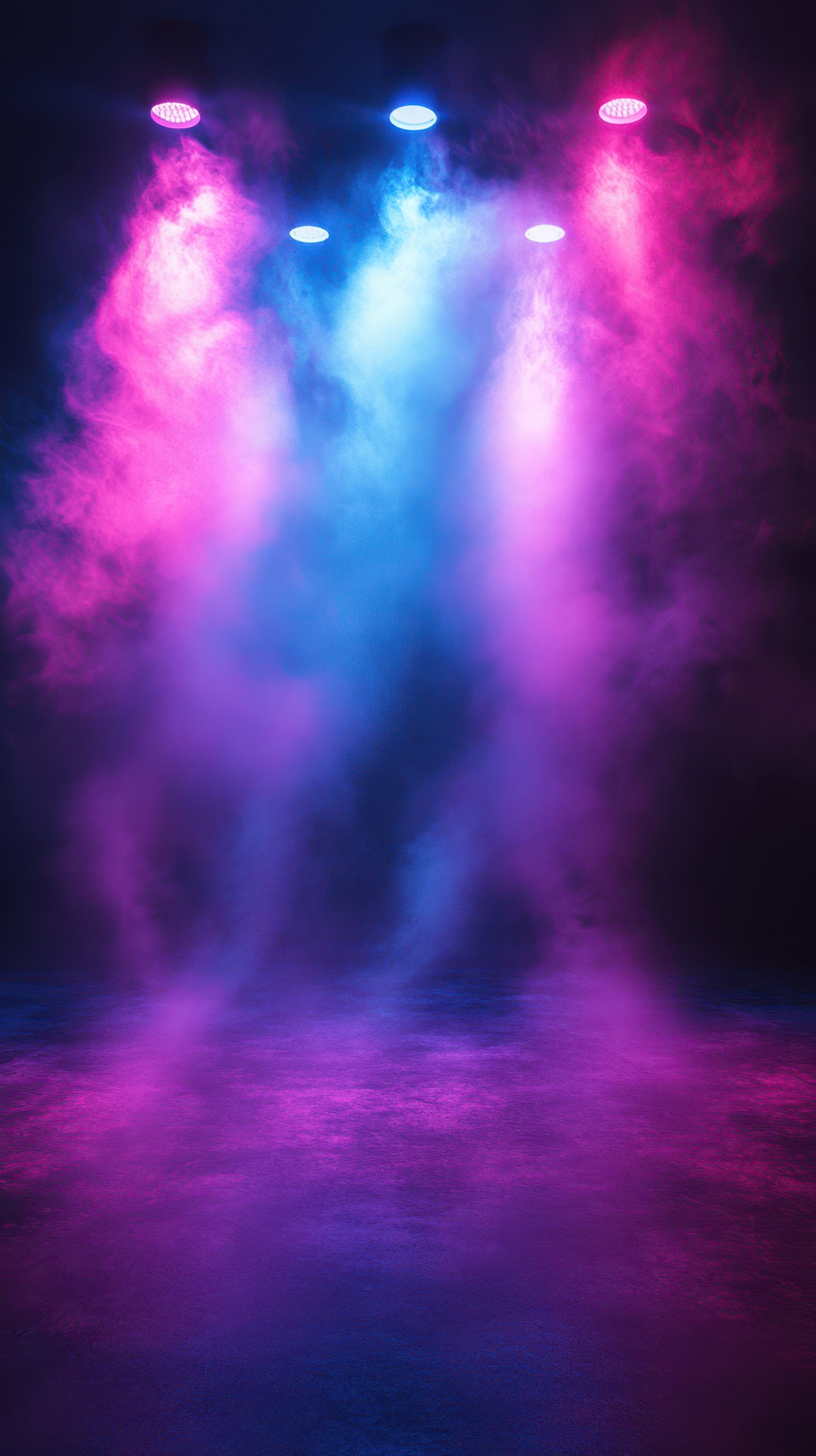 Colorful fog envelops stage under vibrant lighting at nighttime performance venue